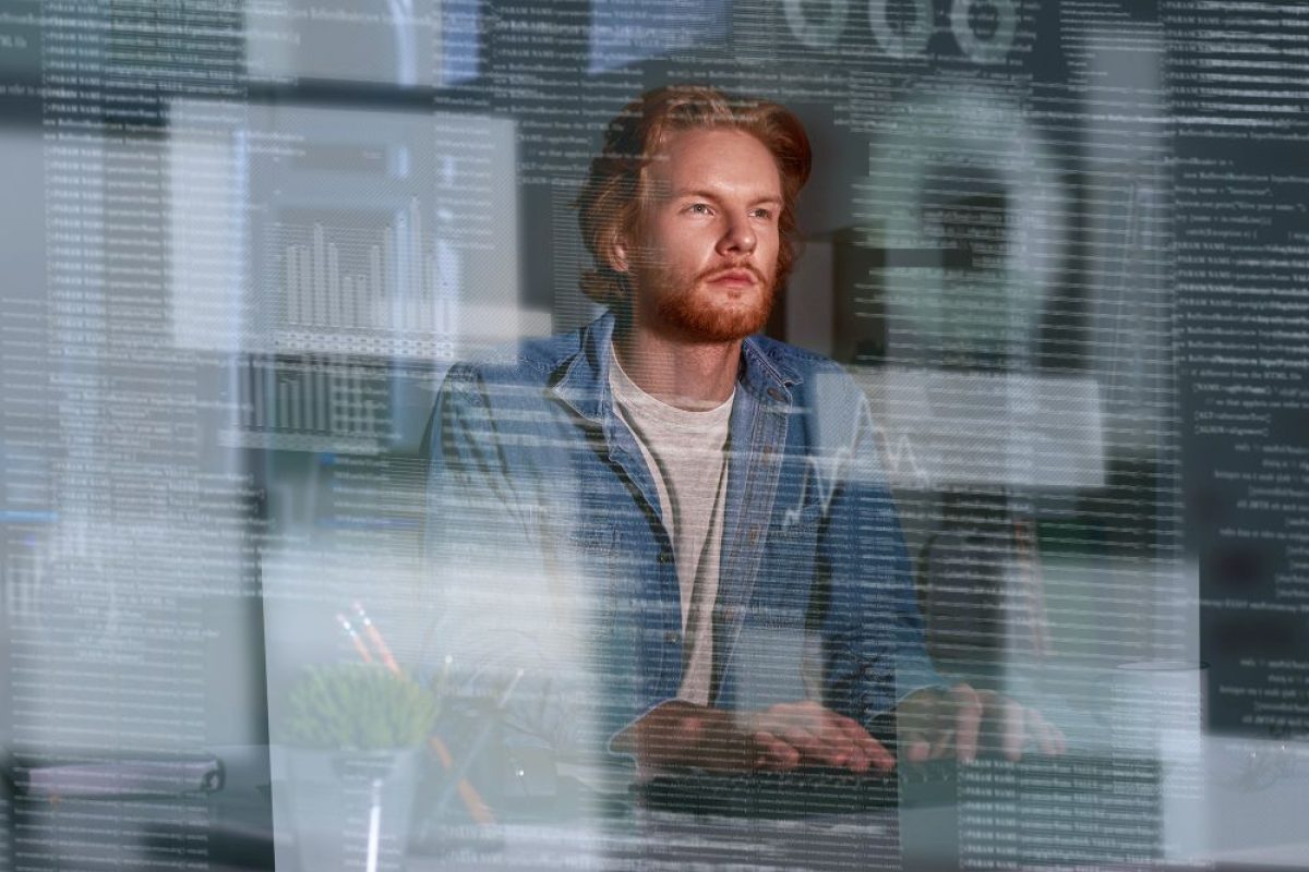 young-concentrated-computer-developer-writing-new-code1